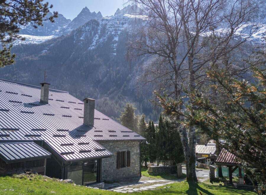 Nestled amidst the breathtaking backdrop of snow-capped mountains, this charming property offers a serene escape.