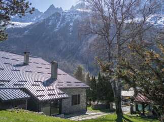 Nestled amidst the breathtaking backdrop of snow-capped mountains, this charming property offers a serene escape.