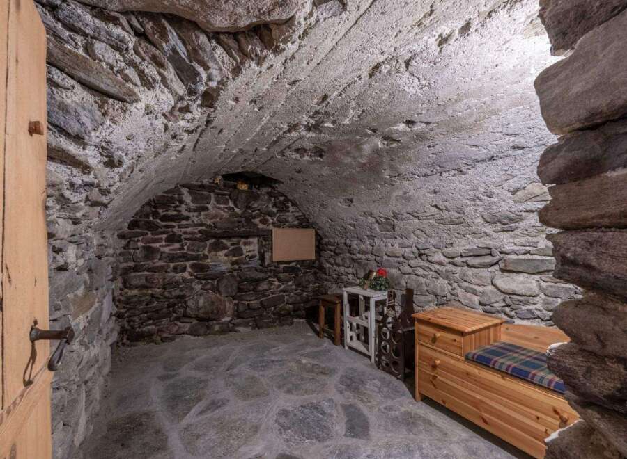 Discover the charm of this unique property featuring a rustic stone interior and a cozy atmosphere.