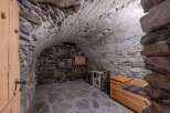 Discover the charm of this unique property featuring a rustic stone interior and a cozy atmosphere.