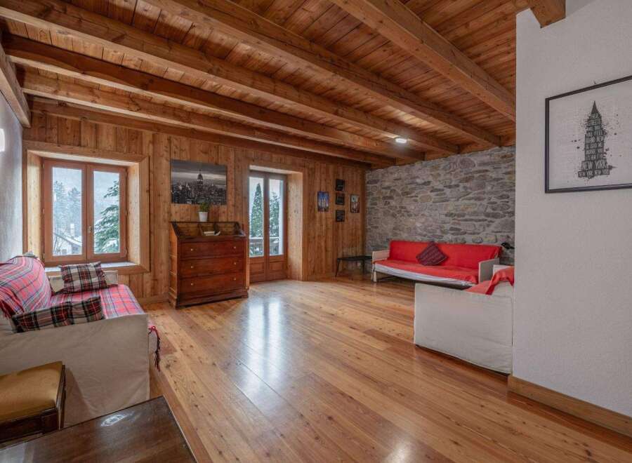 Step into this inviting living space, featuring stunning wooden accents throughout.
