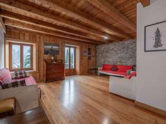 Step into this inviting living space, featuring stunning wooden accents throughout.