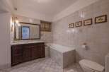 Step into luxury with this elegant bathroom featuring a classic design and high-end finishes.