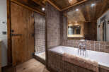 Experience rustic luxury in this stunning bathroom.