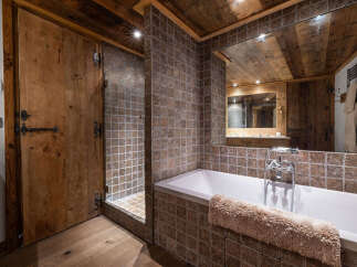 Experience rustic luxury in this stunning bathroom.