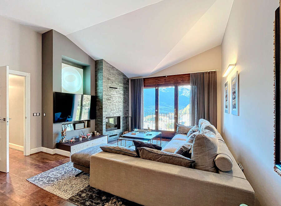 Experience luxury living in this stunning property featuring a modern fireplace and a spacious living area.