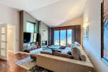 Experience luxury living in this stunning property featuring a modern fireplace and a spacious living area.