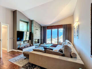 Experience luxury living in this stunning property featuring a modern fireplace and a spacious living area.