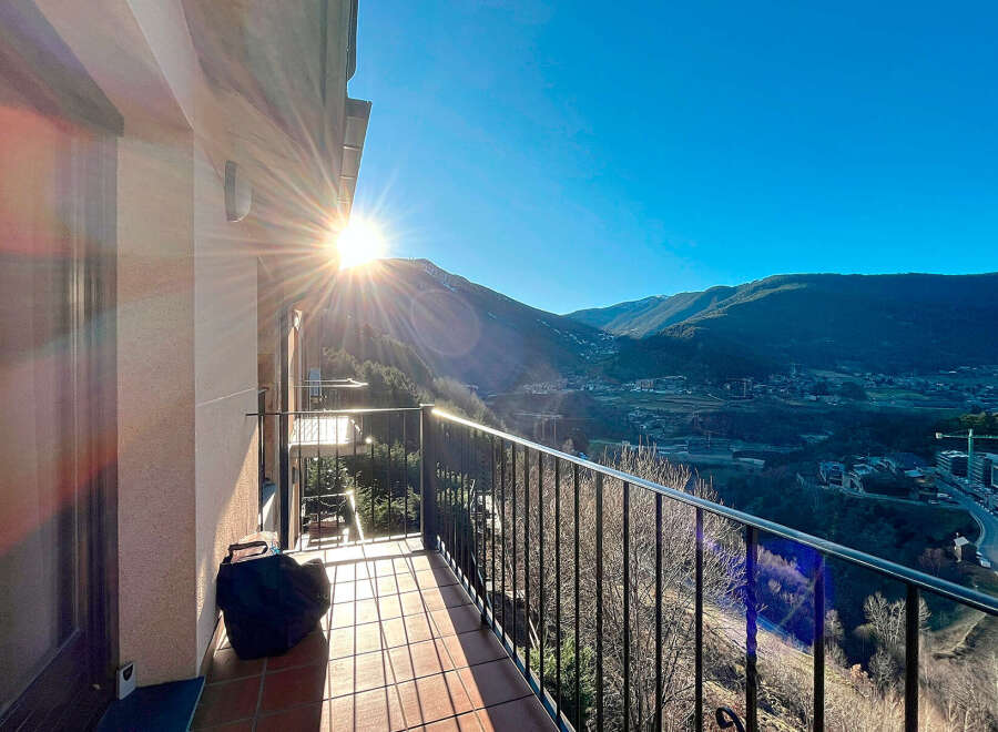 Enjoy breathtaking mountain views from this stunning balcony.