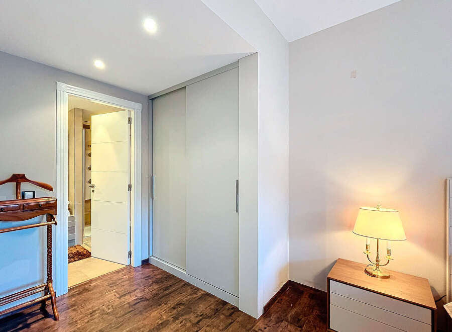Step into this inviting bedroom, featuring a spacious closet and a well-lit interior.