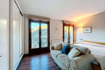 Experience the tranquility of this stunning bedroom with breathtaking mountain views.