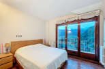 Experience breathtaking mountain views from this stunning bedroom.
