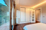 Experience luxury living in this stunning property featuring a spacious bedroom with a private balcony.