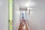 Step into this inviting hallway, showcasing a seamless blend of modern design and warm ambiance.