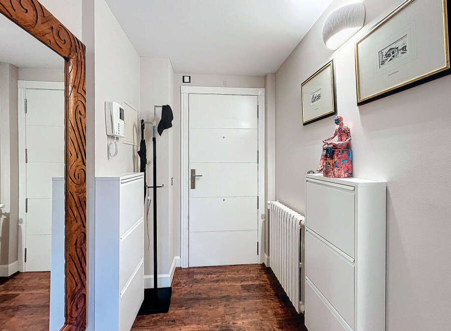 Step into this inviting entryway, showcasing a blend of modern design and functional elegance.