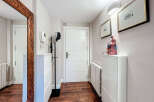Step into this inviting entryway, showcasing a blend of modern design and functional elegance.