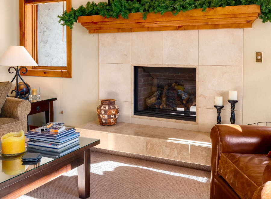 This cozy living space features a stunning fireplace, perfect for creating a warm and inviting atmosphere.