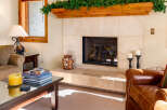 This cozy living space features a stunning fireplace, perfect for creating a warm and inviting atmosphere.