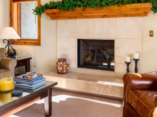 This cozy living space features a stunning fireplace, perfect for creating a warm and inviting atmosphere.