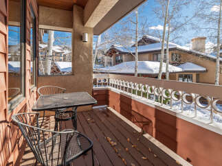 Enjoy breathtaking views from this charming balcony.