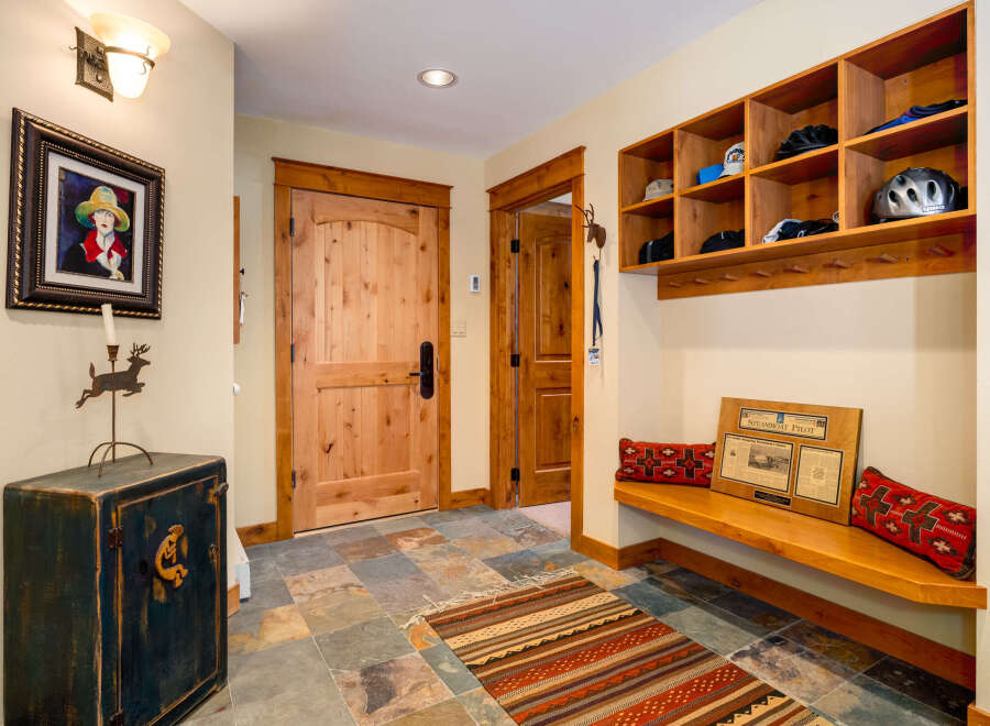 Step into this inviting entryway, showcasing a blend of rustic charm and modern functionality.