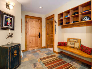 Step into this inviting entryway, showcasing a blend of rustic charm and modern functionality.