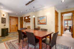 Step into this inviting dining room, showcasing a beautiful wooden dining table and comfortable seating.