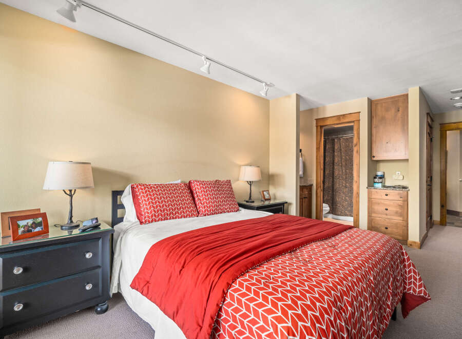 This cozy bedroom offers a comfortable retreat with its inviting decor.