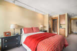 This cozy bedroom offers a comfortable retreat with its inviting decor.