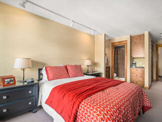 This cozy bedroom offers a comfortable retreat with its inviting decor.