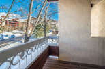 Enjoy breathtaking views from this charming balcony overlooking a winter wonderland.