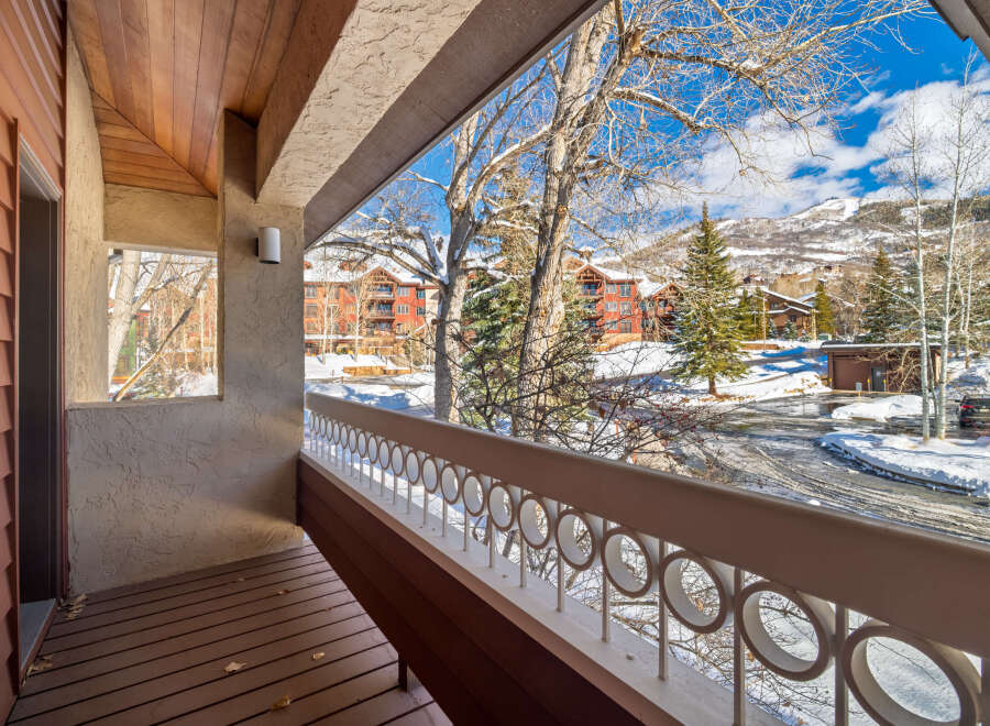 Enjoy breathtaking mountain views from this charming balcony.