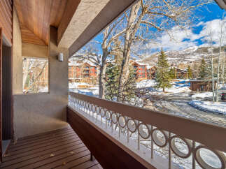 Enjoy breathtaking mountain views from this charming balcony.