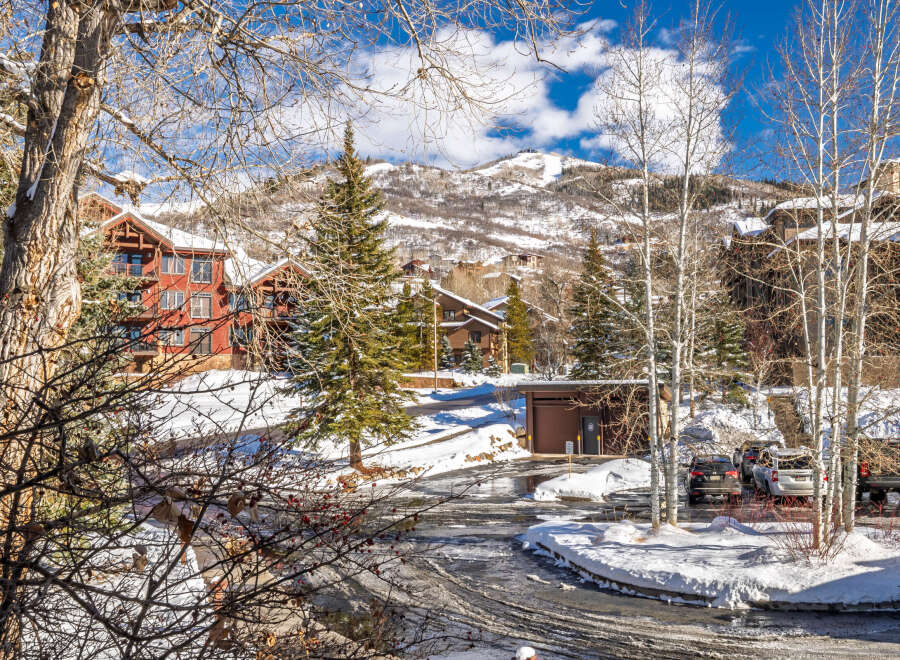 Nestled in a picturesque winter wonderland, this stunning property offers a serene escape.