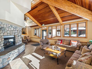 This stunning living area boasts a cozy fireplace, perfect for chilly evenings.