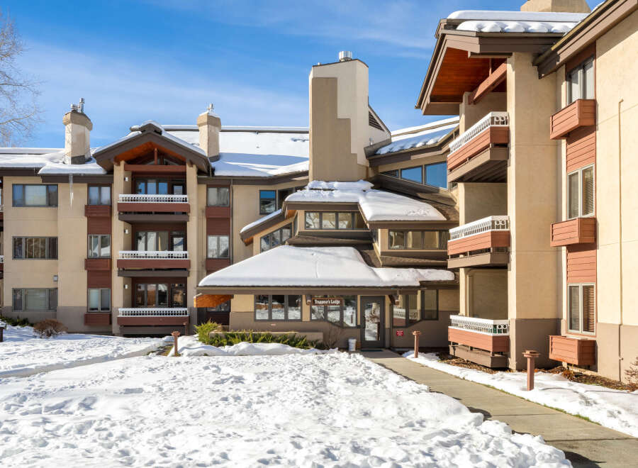 Discover the charm of Trappeur's Lodge, a stunning property nestled in a winter wonderland.