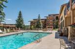 Enjoy a refreshing dip in the inviting outdoor pool, surrounded by stunning architecture and lush greenery.