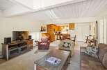 Step into this inviting living space, perfect for relaxation and entertaining.