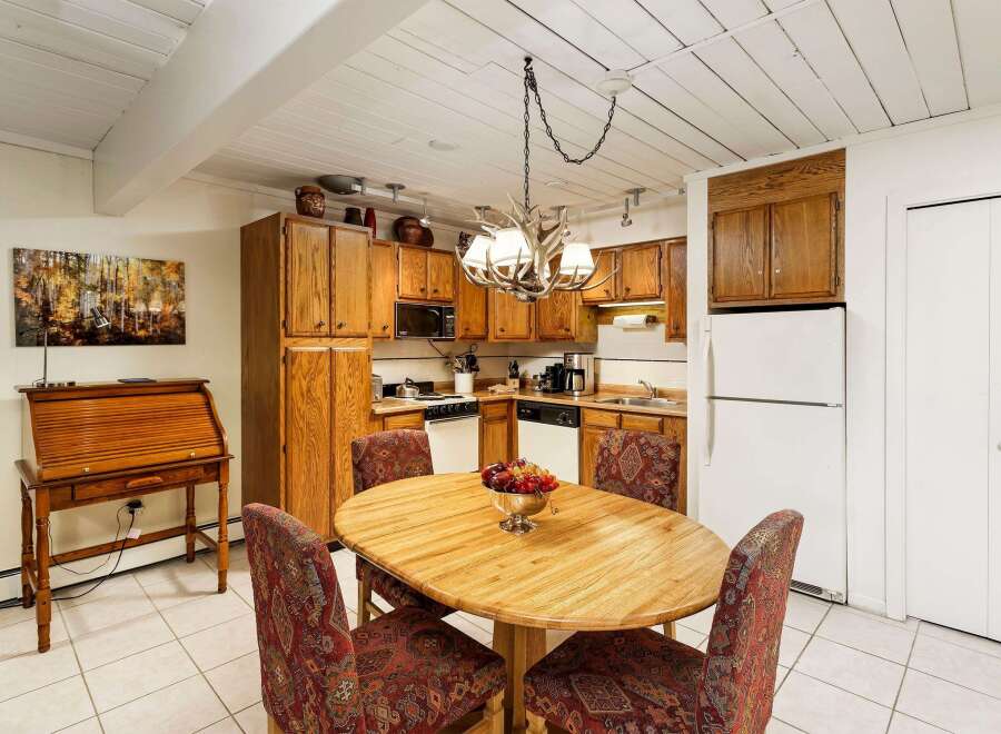 This charming kitchen boasts a warm and inviting atmosphere, perfect for both cooking and entertaining.