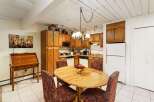 This charming kitchen boasts a warm and inviting atmosphere, perfect for both cooking and entertaining.