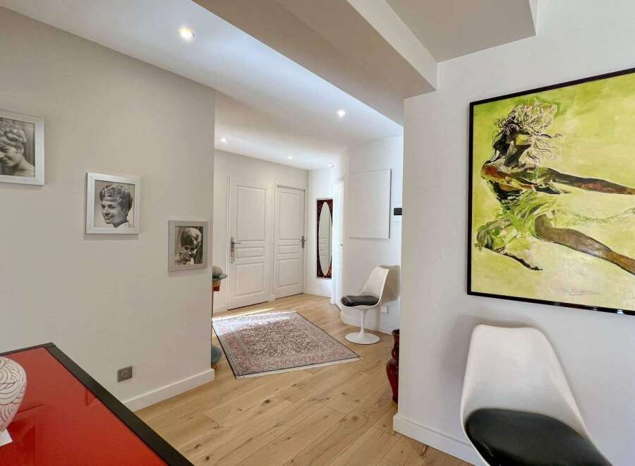 Step into this inviting entryway, showcasing a blend of modern and classic design elements.