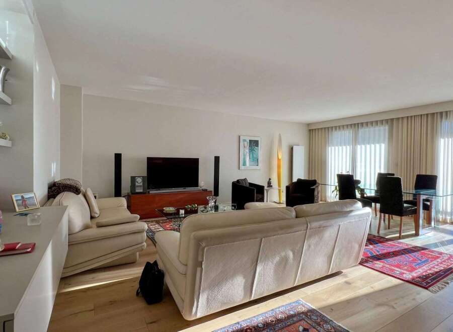 Experience luxury living in this stunning property, featuring a spacious living room with a modern design.