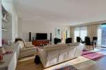 Experience luxury living in this stunning property, featuring a spacious living room with a modern design.