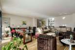 Step into luxury with this stunning property, featuring a spacious living area perfect for entertaining.