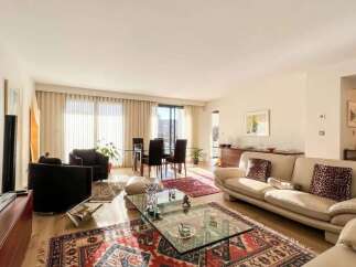 Experience elegant living in this spacious apartment featuring a bright and airy living and dining area.