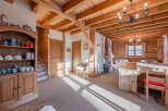 Step into a charming chalet-style home, boasting a warm and inviting atmosphere.