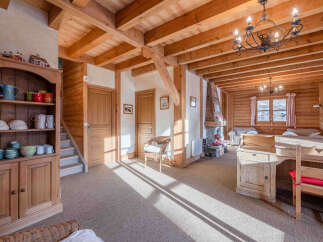 Step into a charming chalet-style home, boasting a warm and inviting atmosphere.