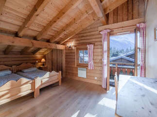 Experience the charm of this cozy wooden cabin, perfect for a mountain getaway.