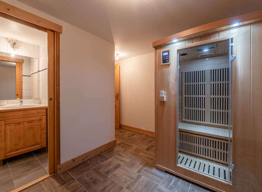 Step into relaxation with this stunning property featuring a private sauna and a well-appointed bathroom.