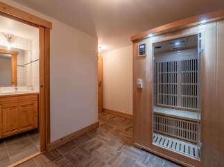 Step into relaxation with this stunning property featuring a private sauna and a well-appointed bathroom.